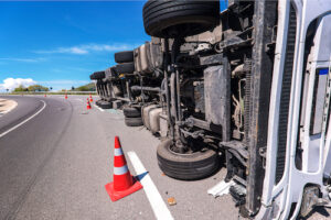 american insurance brokers_truck on side crash accident orange cones road highway
