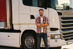 man standing in front of commercial truck
